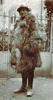mmiddle aged man in French military uniform wrapped up in fur overcoat