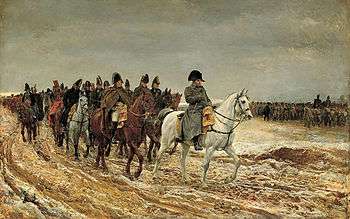 Painting shows a frowning Napoleon leading his generals and staff, all on horseback, along a muddy road. In the background the infantry march under gray skies.