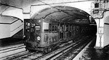 Old Metro train pulling into a station