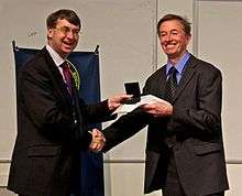 Mike Irwin receiving the Herschel Medal from Roger Davies in 2012