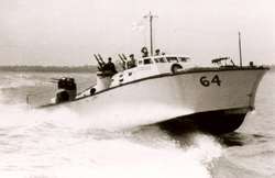 motor gun boat sailing at speed from left to right
