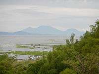 Laguna de Bay at Cardona, with the Banahaw volcano complex in the distance