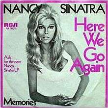 Black and white cover art photo of Nancy Sinatra on one elbow in a white dress. The border is purple as is some of the captioning. Captions says Nancy Sinatra in black. Side captions detail the record label and the song name in purple. The bottom caption has the B-side song name, Memories.