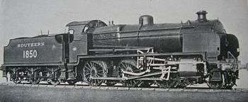 Official side view of a 2-6-0 locomotive against a white background. The distinguishing feature from normal N class locomotives is the experimental motion that powers the wheels.