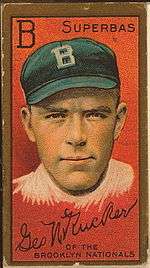 An old-fashioned baseball card of the kind packaged with cigarettes. On a red background is a drawing of a young man's hand and shoulders; he has a serious look on his face and is wearing a blue baseball cap marked "B", for "Brooklyn". Above his head the letter "B" is repeated, and the team's nickname, "Superbas" is given. Below an autograph – "Geo N Rucker" – is reproduced, along with a caption; "of the Brooklyn Nationals".