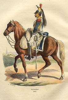 Color print of a cavalryman wearing a helmet with a black horsehair crest, a steel cuirass over a blue coat, and white breeches. He is riding a brown horse.