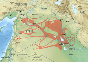 A map of the Middle East showing areas controlled by ISIL in May 2015: a number of major cities in northern Syria and Iraq, and corridors connecting them.