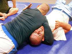 Grapplers demonstrate the North–south choke