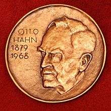 A medallion with an embossed image of Otto Hahn