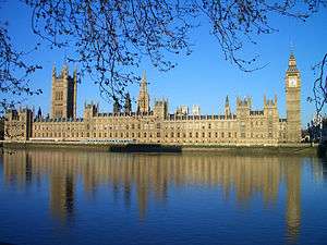 The Houses of Parliament in London, seen across the river, are a large Victorian Gothic building with two big towers and many pinnacles
