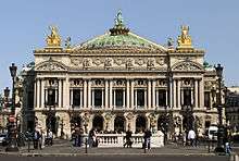 The Opera House in Paris is an ornate 19th century building decorated with much sculptured detail.