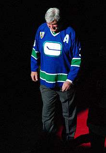 Pat Quinn in a vintage Vancouver Canucks jersey