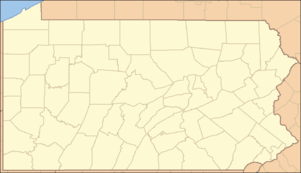 A map of the state of Pennsylvania with a red dot over Lycoming County in the north-central part of the state.