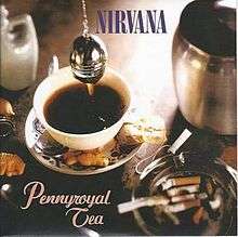 A cup of tea being brewed in a cup. A spoon, biscuits and an ashtray filled with cigarette buts surround the cup. On top of the cup, blue text in block capitals reads "Nirvana" and under the cup, orange italicised text reads "Pennyroyal Tea."