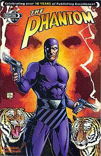 Comic-book cover, with the Phantom holding a gun in each hand and two tigers in the background