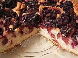 A plum cake with plums baked inside and atop the cake