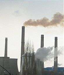 An image of industrial chimney smoke causing air pollution.
