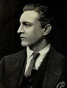 Head and shoulder shot of Barrymore, cleanshaven, in profile, facing to the left