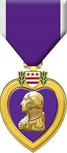 The purple heart medal with a purple suspension ribbon edged in white and a heart-shaped medal depicting the profile and coat of arms of George Washington