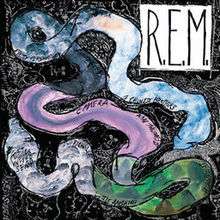 A watercolor painting of a snake with two heads that has the names of the songs from Reckoning written on it, with a large white square in the upper-left corner that has "R.E.M." written in it