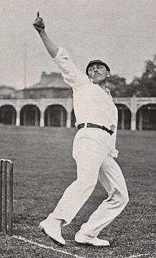 A cricketer bowling, seen from the front
