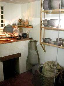 Kitchen corner, with pottery and basket