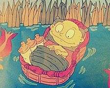 A smiling cartoon baby lying in a basket filled with bottles, floating on water from which rushes grow.