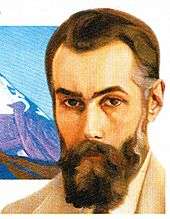 Colour portrait of a man with beard.