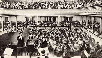 interior of packed concert hall during a concert