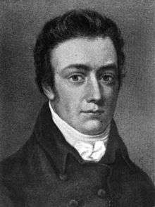 Head and shoulders portrait of a young man with short sideburns. He wears a high collar with a small bow and a coat, and is looking at the viewer.