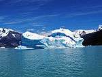 A glacier calving into the sea or a lake.