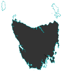 A map showing one large island (Tasmania) and two small islands north of it. The whole of Tasmania is coloured in and the waters and small islands are not, as the devil is not extant there.