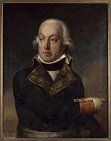 Painting of a man in a dark blue military coat of the 1790s with gold lace trim. He wears a white wig with hair curled at the ears and points to the viewer's right.