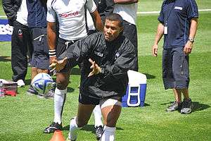Serevi on one knee ready to take a pass