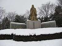A golden statue of Murasaki Shikibu