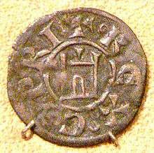 An old coin depicting a building