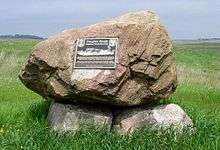 Simple rock cairn with bronze plaque