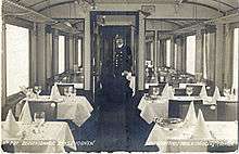 restaurant carriage, with tables set for dinner
