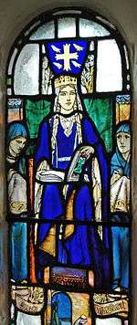 A blue-robed woman wearing a crown