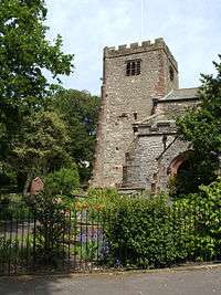 The battlemented tower and west part of a stone church