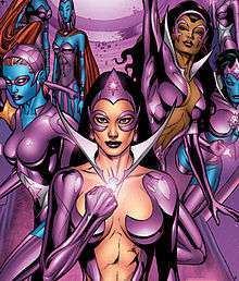 A cartoon image of four super heroines wearing glossy, violet costumes. The woman on the far left is wearing a small mask and has blue skin. The woman centered, standing in front of the rest, has long hair, a provocatively low cut costume, and wearing a glowing violet ring that she is holding up at chest height. The woman immediately to the right of her is wearing a similar costume and is flying upward. The woman on the far right is flying toward the viewer, has blue skin, and no nose.
