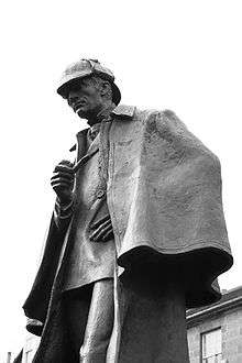 Statue of Holmes, holding a pipe