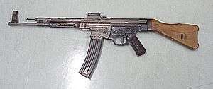StG 44 German assault rifle with curved magazine and wooden stock facing left