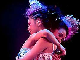 Twins hug each other on The Missing Piece Concert in 2006