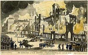 Coloured aquatint of the Burning of Parliament. Firemen are pictured in front of the building, while soldiers are seen towards the left of the image, keeping back crowds.