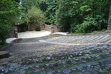 A stone amphitheater in the wooden location.