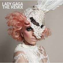 Lady Gaga's face covered in white lace and feathers