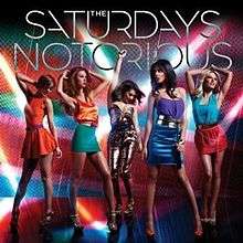 The background it was red, green, blue and orange. The 5 girls are dancing on the floor. On the group name is (The Saturdays) and the name of the single (Notorious)