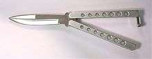A butterfly knife with steel handles and lightening holes.