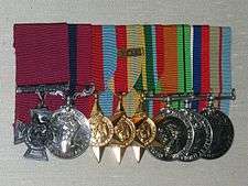 A group of eight military medals.